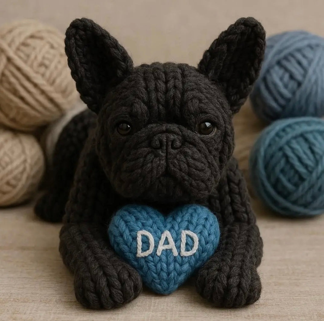 Knitted black French Bulldog with a blue heart that says DAD